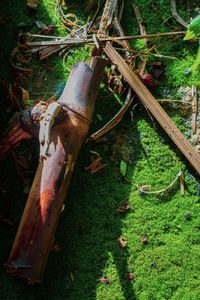 High angle view of rusty metal on field