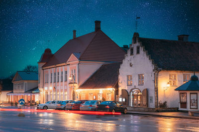 Buildings in city at night