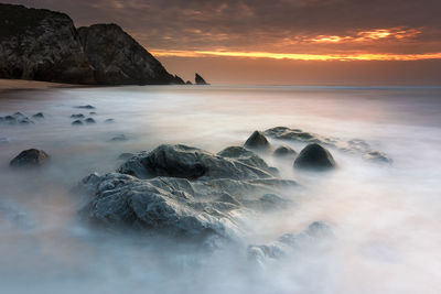 Scenic view of sea against sky during sunset