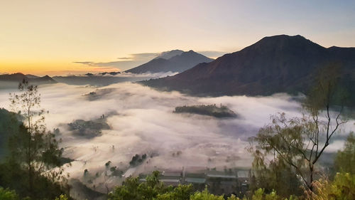 Scenic view of mountains against sky during sunset