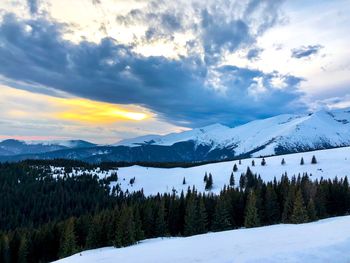 Scenic view of snowcapped mountains against sky