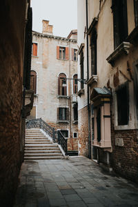 Narrow alley amidst buildings in town