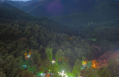 High angle view of trees and mountains at night