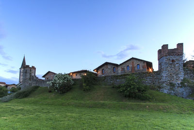 Houses on grassy field