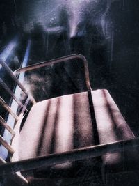 Close-up of metal railing against building