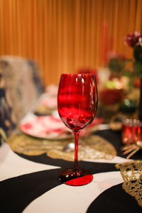 Close-up of red wineglass on table in restaurant