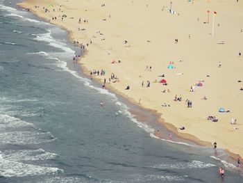 People enjoying on beach