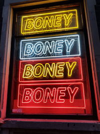 Text written on illuminated restaurant at night