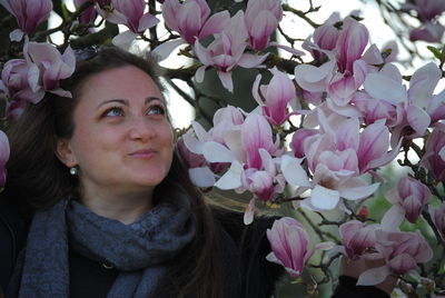 Portrait of woman with pink flowers