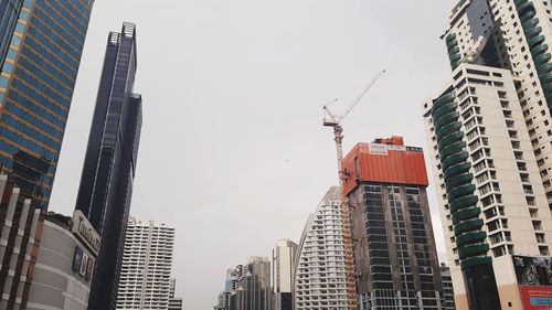 Low angle view of modern buildings against clear sky