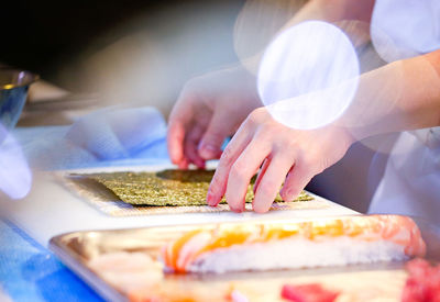 Midsection of man preparing food