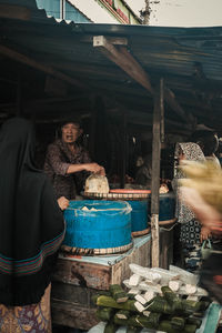 Man selling food at market