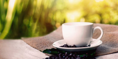 Close-up of coffee cup on table