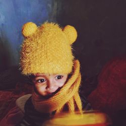 Portrait of cute girl with toy at home