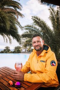 Portrait of smiling man sitting in restaurant