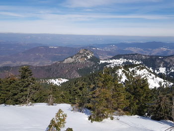 Scenic view of snowcapped mountains against sky