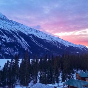 Scenic view of mountains against sky during winter