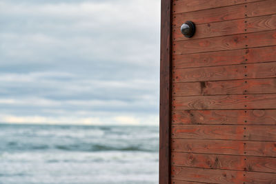 Close-up of wooden door on beach