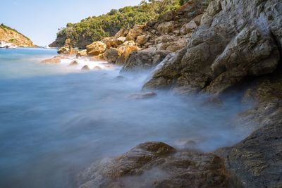 Scenic view of rocks in sea