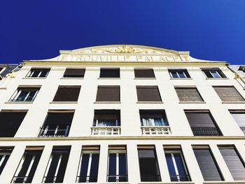 Low angle view of building against blue sky