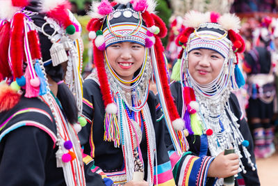 Portrait of women standing in traditional clothing