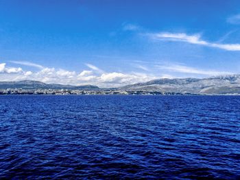 Scenic view of sea against blue sky