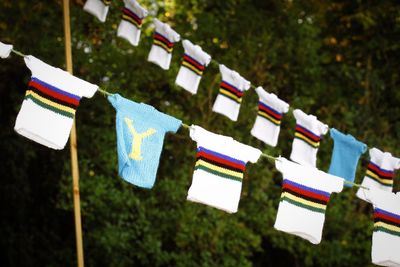 Multi colored flags hanging on clothesline