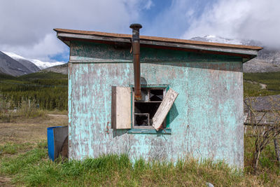 Old ruin on field against sky