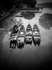 High angle view of boats moored in water