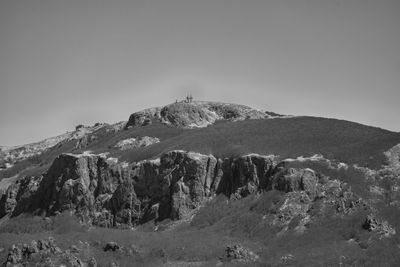 Scenic view of snowcapped mountains against clear sky