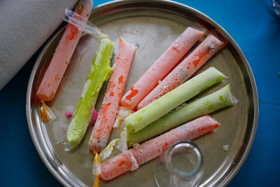 High angle view of vegetables in plate on table