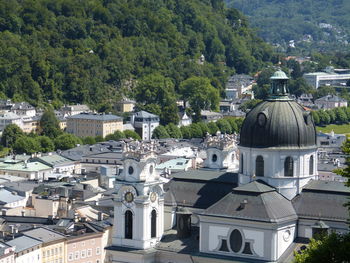 High angle view of townscape against trees and buildings