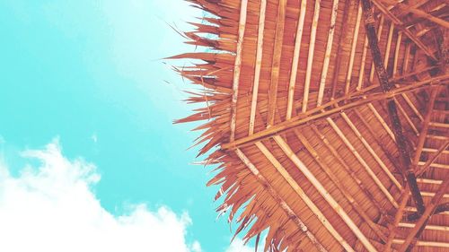 Low angle view of sunshade against sky