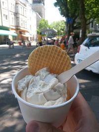 Close-up of hand holding ice cream