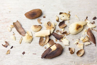 Close-up of crushed roasted almonds on table