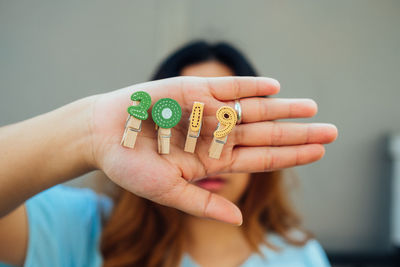 Close-up portrait of woman holding hands