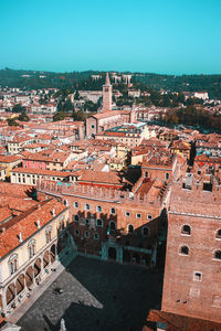 Sunny day in verona, italy. view from above on old town red roofs, square, streets and landmarks.