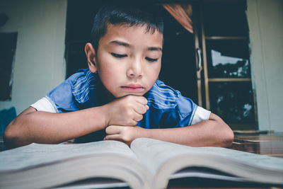 Boy looking at book