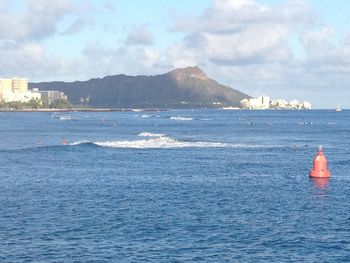 Scenic view of sea against cloudy sky