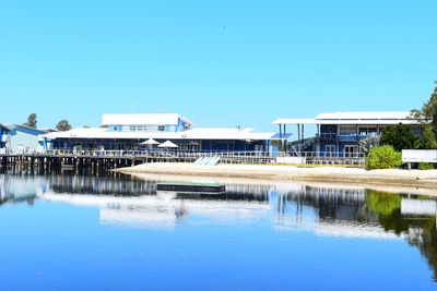 Built structures against clear blue sky