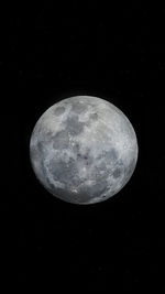 Low angle view of moon against sky at night