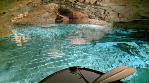 Reflection of rocks in swimming pool