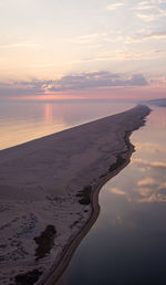 Scenic view of beach against sky during sunset