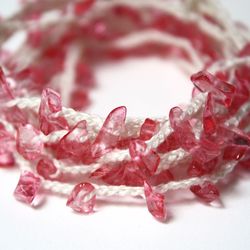 Close-up of pink petals on white background