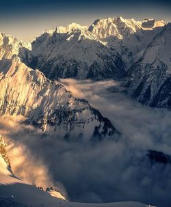 Scenic view of snowcapped mountains against sky