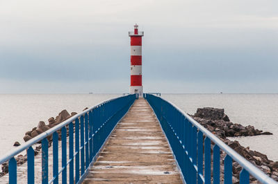 Pier over sea against sky