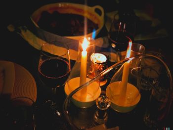 High angle view of illuminated candles on table