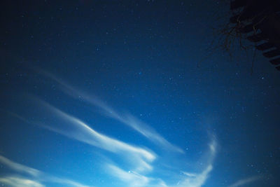 Low angle view of star field against clear blue sky