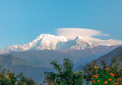 Scenic view of snowcapped mountains against sky