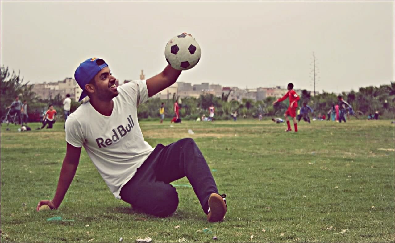 grass, leisure activity, lifestyles, field, sport, playing, fun, togetherness, boys, men, full length, childhood, casual clothing, enjoyment, grassy, mid-air, competition, happiness, green color